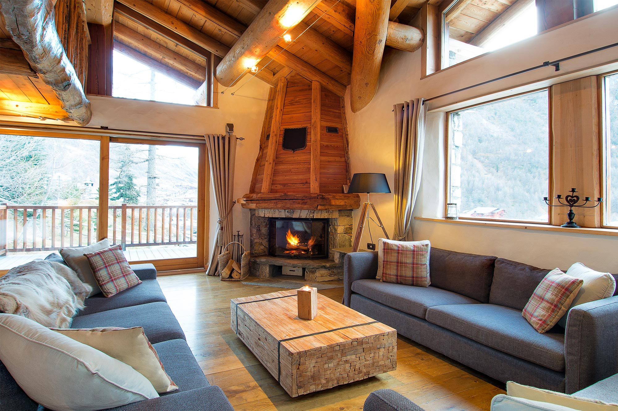 Living room with fireplace in Chalet Arosa in Val d'Isere Ski France Premium Chalets