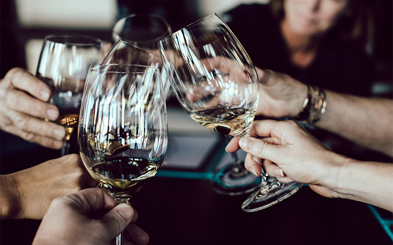 Glasses cheering during a dinner in the French Alps
