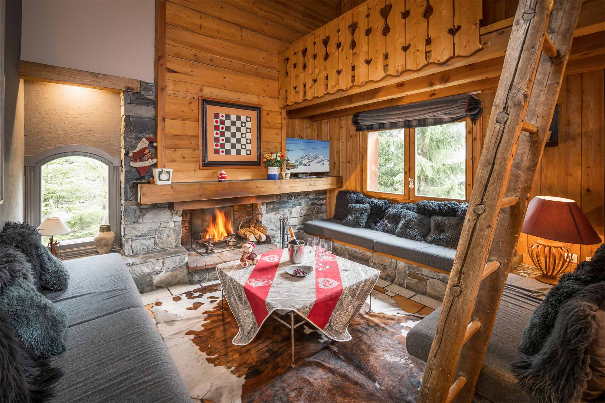 Living room with fireplace in Chalet Etienne in Meribel Ski France Premium Chalets