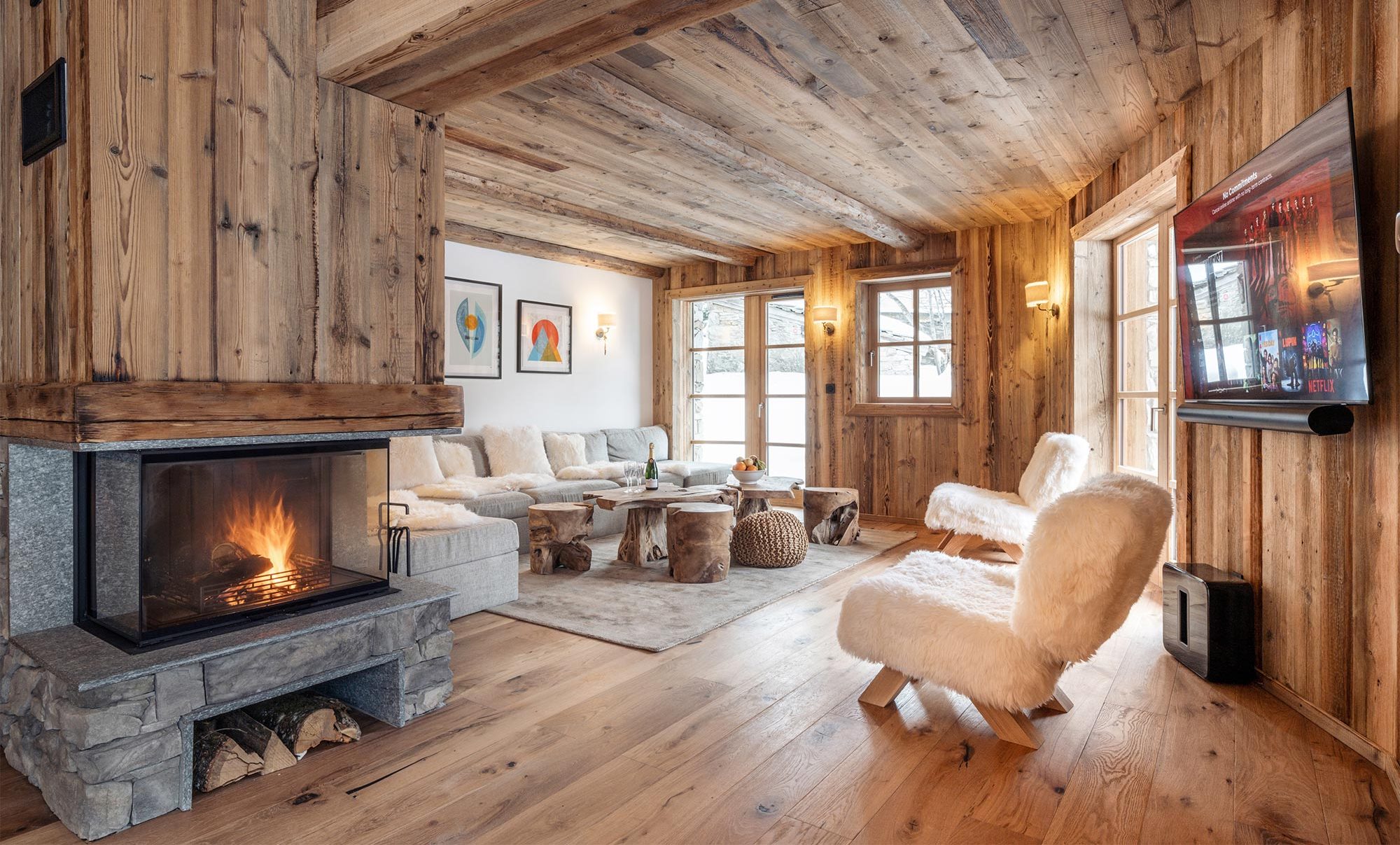 Living room with fireplace in Chalet Les Sources de l'Isère in Val d'Isère Ski France Premium Chalets